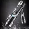 A black LED flashlight is shown in a dynamic pose with water splashing around it, suggesting it is waterproof. Another blurred flashlight is visible in the background. Anteprima dell’immagine prodotto