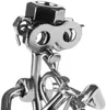 A close-up of a metal figurine of a musician playing a trumpet. Náhled obrázku produktu