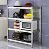 A stainless steel shelving unit with kitchen appliances and food items on display. Voir les images du produit