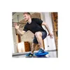 A man is exercising on a balance board in a gym. Produktbild-Vorschau