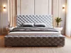 A tufted upholstered bed with a headboard and footboard, set in a bedroom with bedside tables and wall sconces. Produktbild-Vorschau