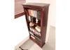 A tall, dark wood bookcase filled with books and decorative items. Produktbild-Vorschau