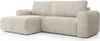 A beige corduroy sectional sofa is shown from a side angle against a white background. Podgląd zdjęcia produktu