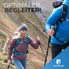 Two people hiking up a mountain trail, one in the foreground and one in the background. Produktbild-Vorschau