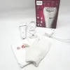 A Philips Series 8000 epilator and its accessories are laid out on a white surface, with the product packaging in the background. Náhled obrázku produktu