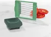 A kitchen slicer and its components are displayed on a marble countertop. Produktbild-Vorschau