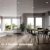 A split image showing a living room and dining room with different lighting levels, illustrating dimmable features. Produktbild-Vorschau