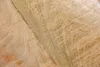 A close-up view of the textured surface of a wooden table. Produktbild-Vorschau