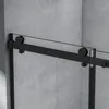 A close-up view of a black sliding shower door track and rollers against a textured gray wall. Produktbild-Vorschau