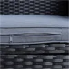 A close-up view of a gray cushion with a zipper on a black rattan furniture base. Produktbild-Vorschau