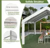 A white party tent set up outdoors with tables and benches. Produktbild-Vorschau