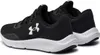 A pair of black and white Under Armour running shoes. Produktbild-Vorschau