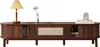 A wooden TV stand with decorative items on top. Podgląd zdjęcia produktu