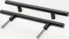 Two black cabinet handles are shown on a white background. One handle is placed above the other, and the bottom handle has screws partially inserted into its mounting holes. Produktbild-Vorschau