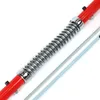 A close-up view of a red and silver tow bar with a coiled spring mechanism. Podgląd zdjęcia produktu