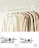 A clothing rack filled with garments and close-up views of the rack's poles with measurements. Produktbild-Vorschau