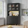 A dark gray sideboard with glass doors is shown in a kitchen or dining room setting, next to a window and a white cabinet. Náhľad obrázku produktu