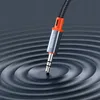 A close-up shot of a 3.5mm audio jack connector with the brand name 'Mcdodo' visible, set against a dark, rippling background. Anteprima dell’immagine prodotto