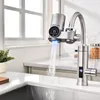 A modern kitchen sink with a faucet dispensing water. Produktbild-Vorschau