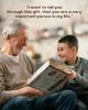 An elderly man and a young boy are sitting on a couch, with the boy handing a gift box to the man. The man is smiling and looking at the boy, while the boy is also smiling and looking at the man. Produktbild-Vorschau