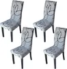Four dining chairs with a floral pattern on a white background. Produktbild-Vorschau