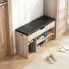 A shoe cabinet with a bench seat is shown in a hallway next to a door and a closet. Podgląd zdjęcia produktu