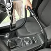 A person is vacuuming the interior of a car with a Bosch handheld vacuum cleaner. Produktbild-Vorschau