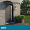 A doorway with an awning, a door, a light fixture, and plants in a planter. Náhled obrázku produktu
