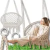 A woman relaxing in a hammock chair, with another hammock chair and rings shown separately. Produktbild-Vorschau