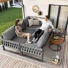 A couple relaxing on a modular outdoor sofa set on a wooden deck, with a small side table and a basket of items nearby. Produktbild-Vorschau