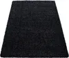 A black shaggy rug is shown from a slightly elevated angle against a white background. Anteprima dell’immagine prodotto