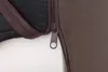 A close-up view of a zipper on a brown fabric product, with a black textured material visible underneath. Produktbild-Vorschau
