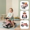 A baby girl is sitting on a pink ride-on car in a room with pastel green and beige walls. There are also inset images of the car from different angles. Produktbild-Vorschau