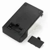 The underside of a black digital scale with the battery compartment cover removed. Voir les images du produit