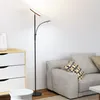 A modern living room with a couch and a floor lamp. Podgląd zdjęcia produktu
