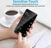 A person's hands are holding a smartphone displaying an alarm clock app, with a cup of coffee and a notebook in the background. Produktbild-Vorschau