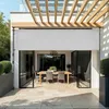An outdoor patio with a dining set and a retractable awning. Náhled obrázku produktu