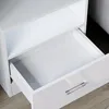 A close-up view of an open white drawer with a silver handle, part of a piece of furniture. Produktbild-Vorschau