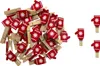 A pile of red and white mitten-shaped clothespins on a white background, with a few scattered to the right. Produktbild-Vorschau