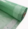 A roll of green greenhouse film with a grid pattern. Produktbild-Vorschau