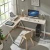 A modern L-shaped desk setup in a home office, featuring a computer, printer, lamp, and chair. Voir les images du produit