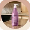 A bottle of Arkemusa hair conditioner is placed on a countertop in a kitchen or bathroom setting. Náhľad obrázku produktu