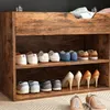 A shoe cabinet with shoes on its shelves. Náhled obrázku produktu