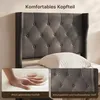 Close-up of a dark gray upholstered headboard with tufted buttons, with inset images showing a hand pressing into a soft cushion and a detail of the fabric. Anteprima dell’immagine prodotto