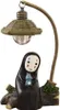 A decorative lamp featuring a character from Japanese animation, with a rustic base. Produktbild-Vorschau