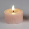 A close-up studio shot of a pink LED candle with a lit flame. Produktbild-Vorschau