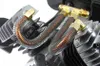 A close-up view of the compressor unit's cylinder head and cooling pipes. Anteprima dell’immagine prodotto
