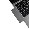 A close-up view of a gray MacBook Air laptop with a USB-C hub attached to its side. Voir les images du produit