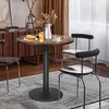 A round table with two chairs in a dining or living room setting. Produktbild-Vorschau