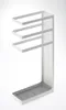 A white metal umbrella stand with a gray tray at the bottom, set against a white background. Anteprima dell’immagine prodotto